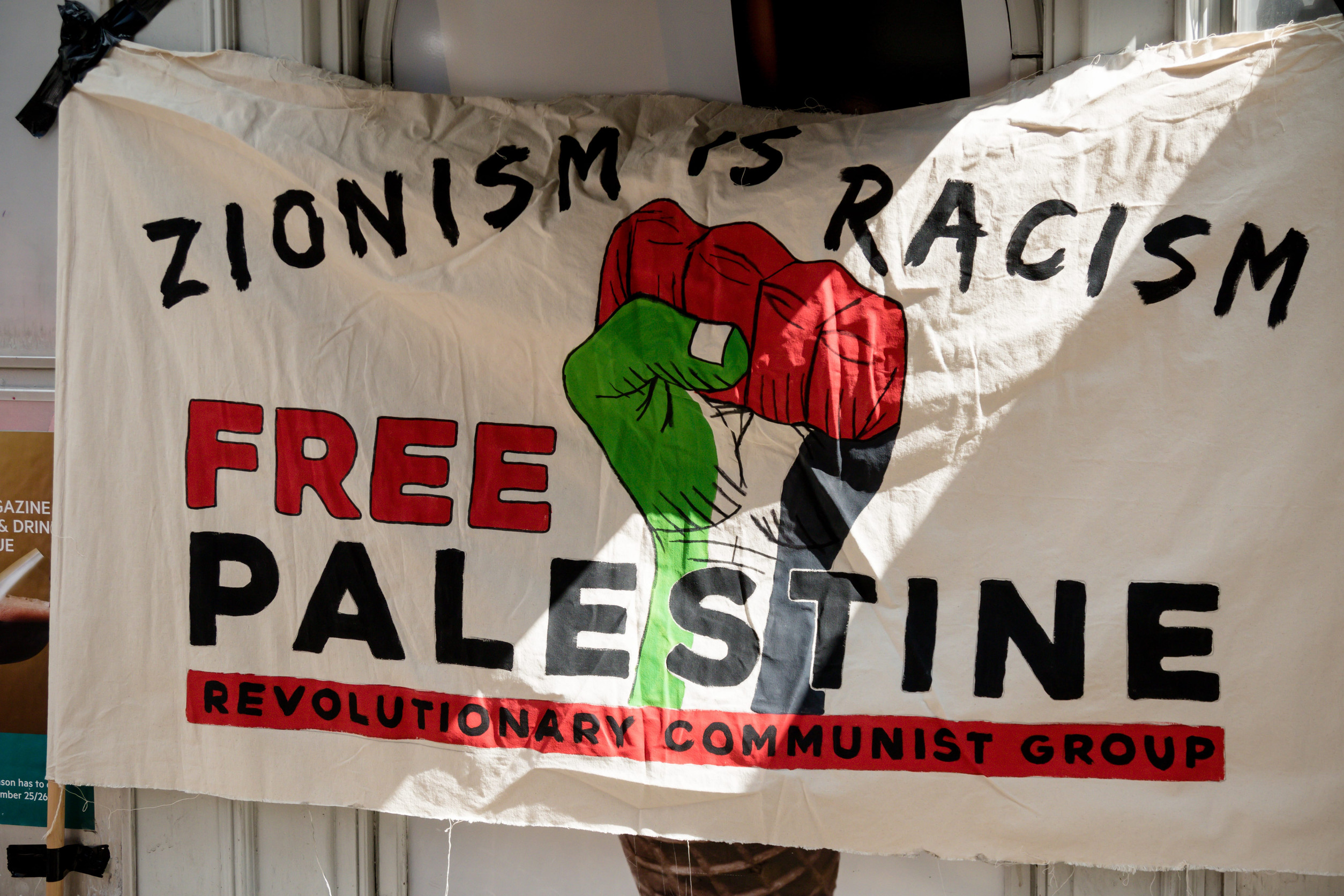 London, United Kingdom, 14th April 2018:- Banner at a gathering of protesters along Kensington High Street, near the Israeli Embassy in London to protest the ongoing occupation of Palestine.