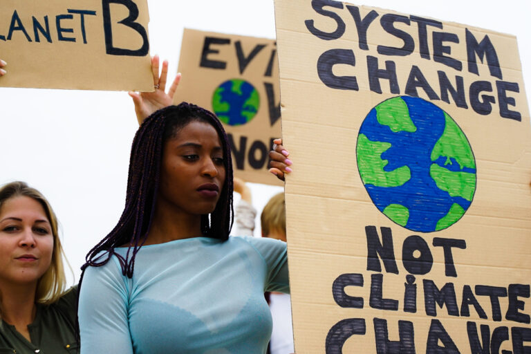 People protesting against multicultural opinion. Young people from diferent countries showing their ideology. Yought together under same defense - Focus face - Image