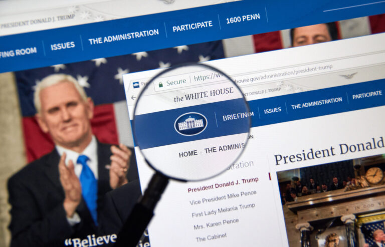 MONTREAL, CANADA - OCTOBER 2, 2017: Trump Administration web site under magnifying glass. Donald J. Trump is the 45th President of the United States.