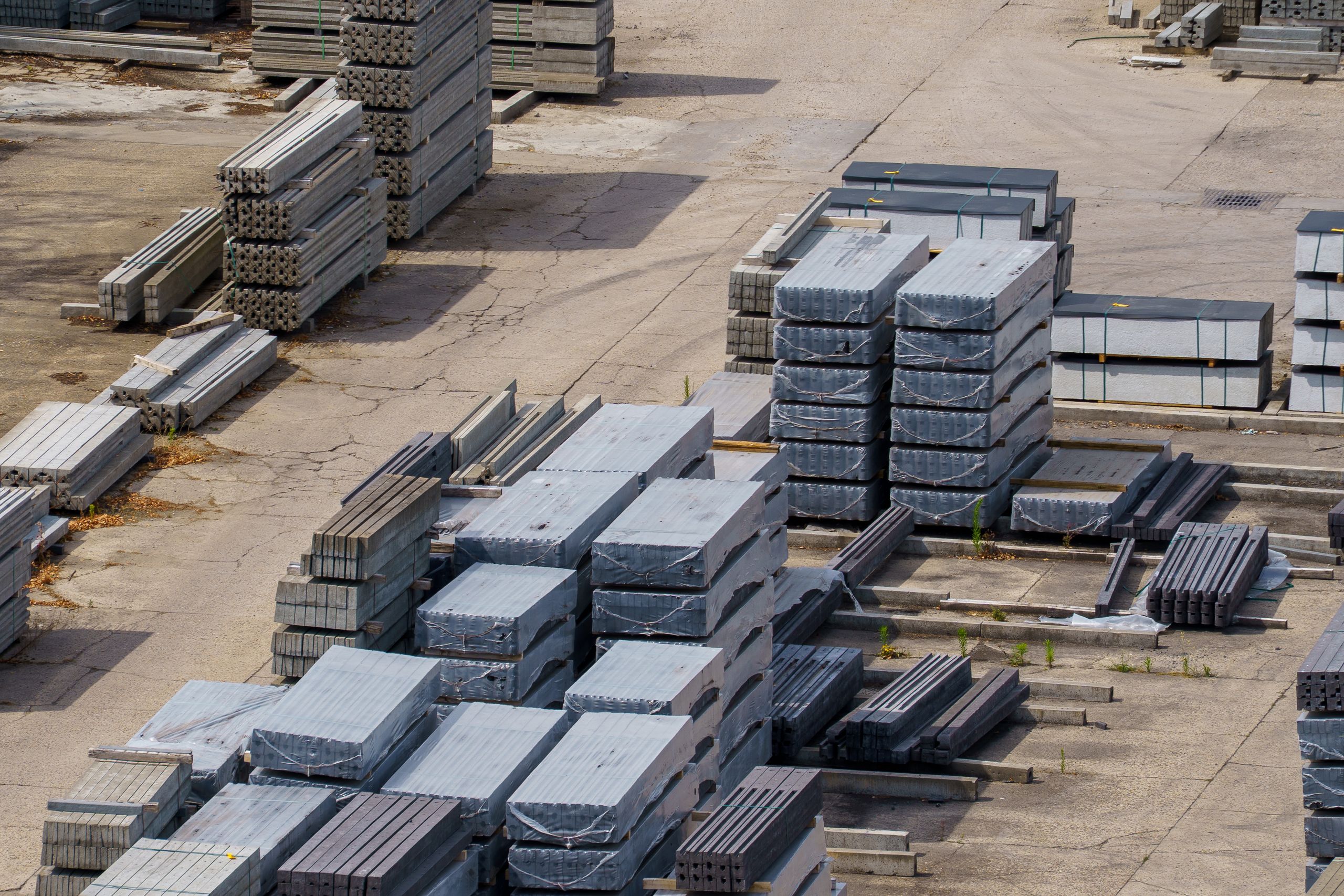 Aerial view of stacked concrete blocks in an industrial yard in Dessel, Belgium.