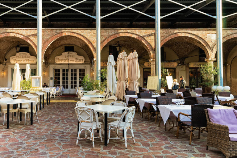 Mantua, Italy - October 22, 2016: Street restaurant on Piazza delle Erbe Square in Mantua, Lombardy, Italy