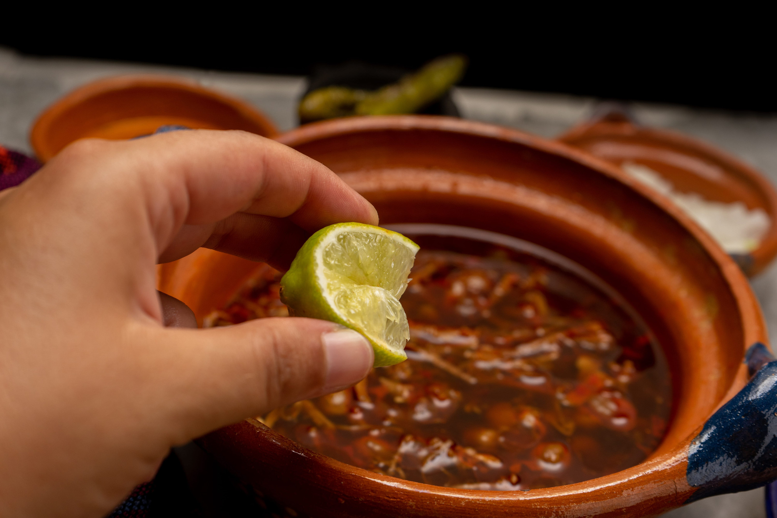 Beef birria with chickpeas on a gray background. Traditional mexican food