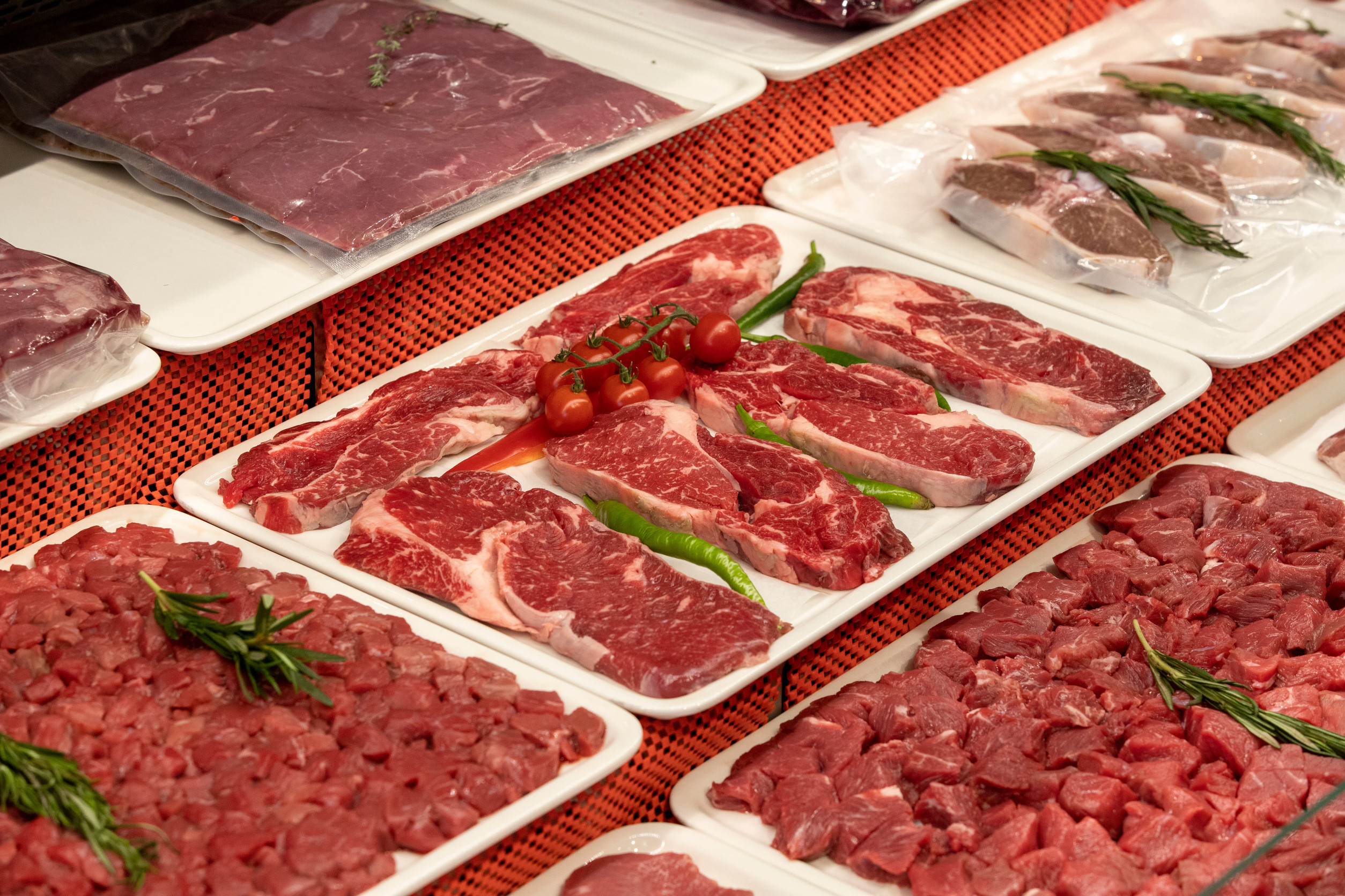 Selection of quality meat in a butcher shop. Different types of fresh meat are on display. meat assortment