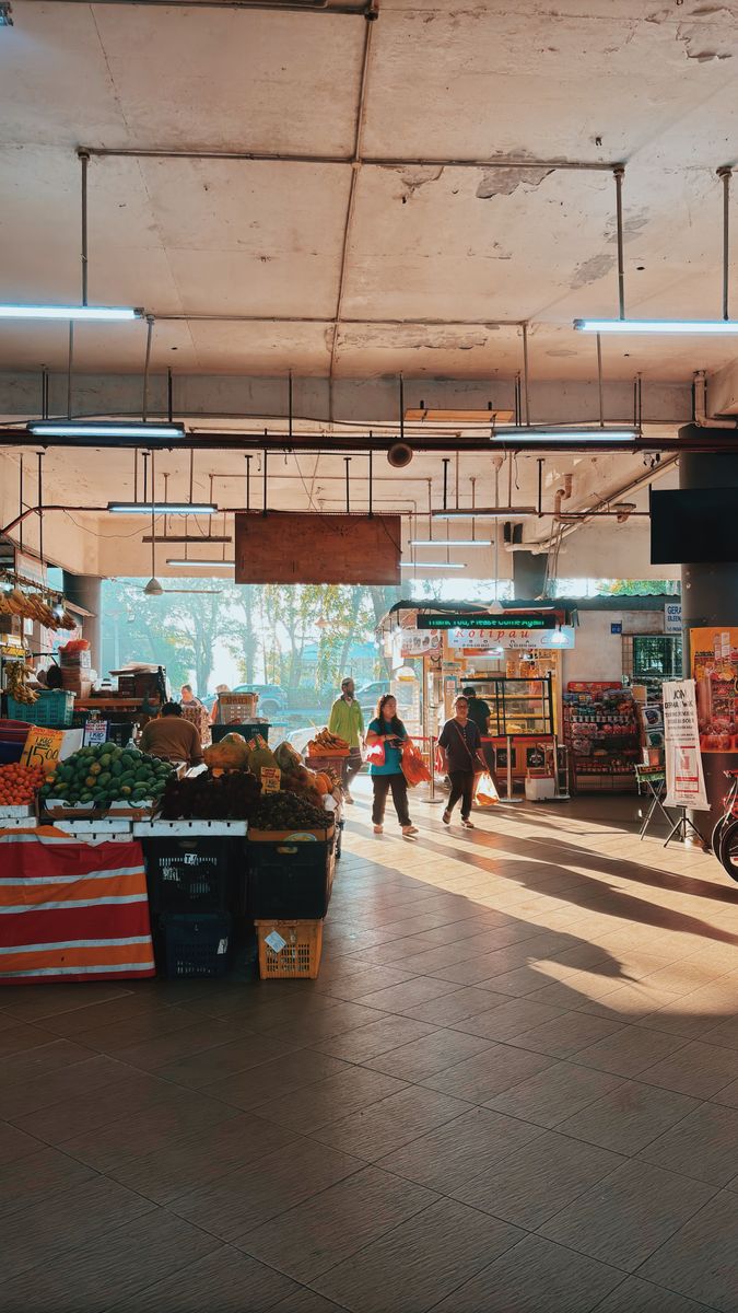 Vibrant fruit and vegetable market in Shah Alam, Malaysia, with morning shoppers.