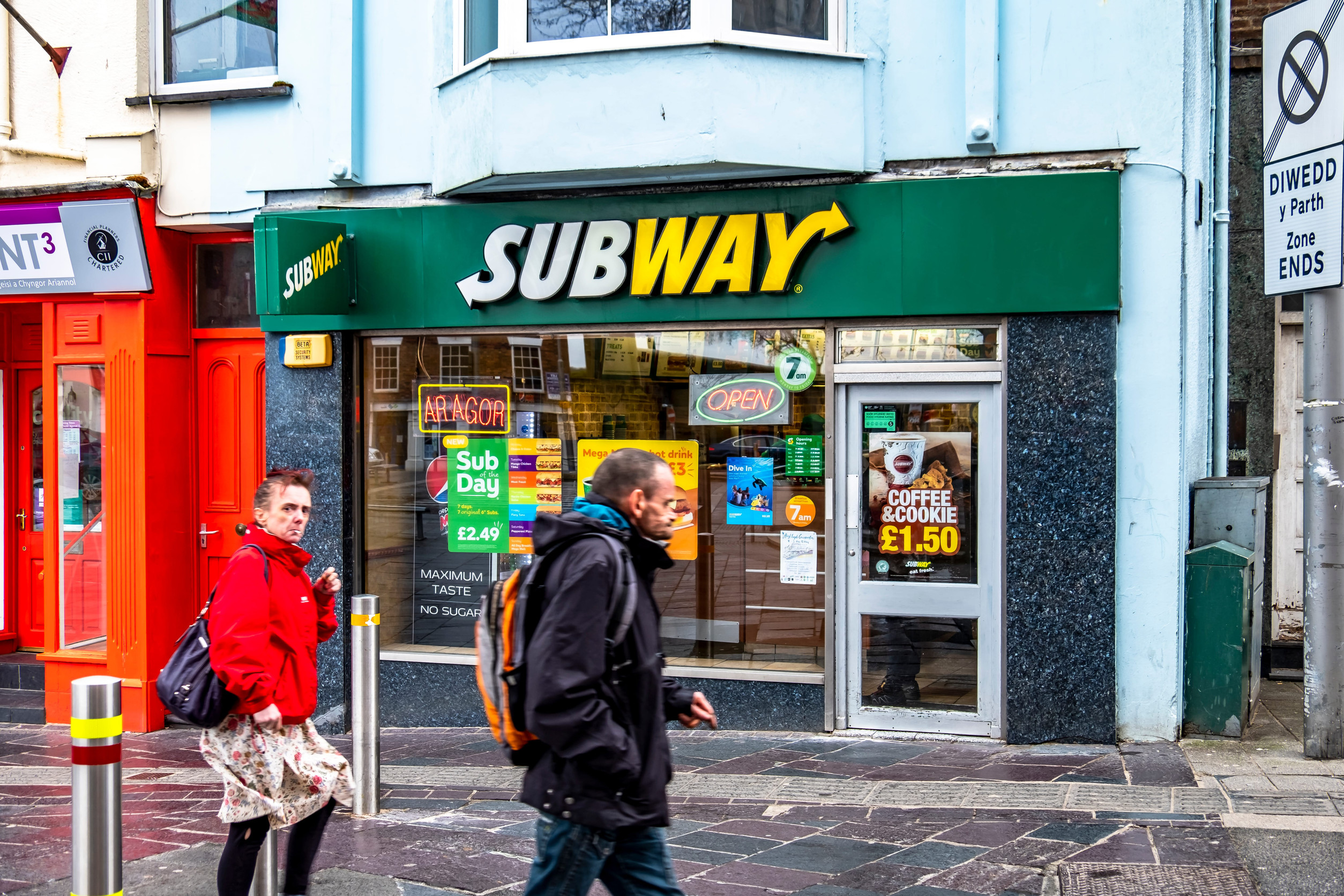 Caernarfon / Wales - May 01 2018 : Subway on a windy day in the rain
