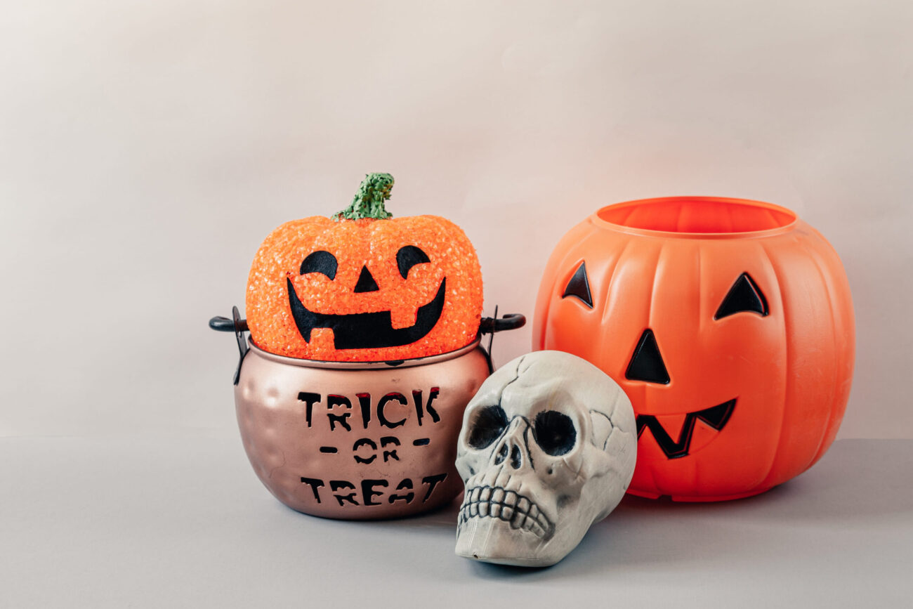 Pumpkin trick or treat basket, orange pumpkins, scary metal house for Halloween Day. Image Credit: reginafoster88/ 123RF