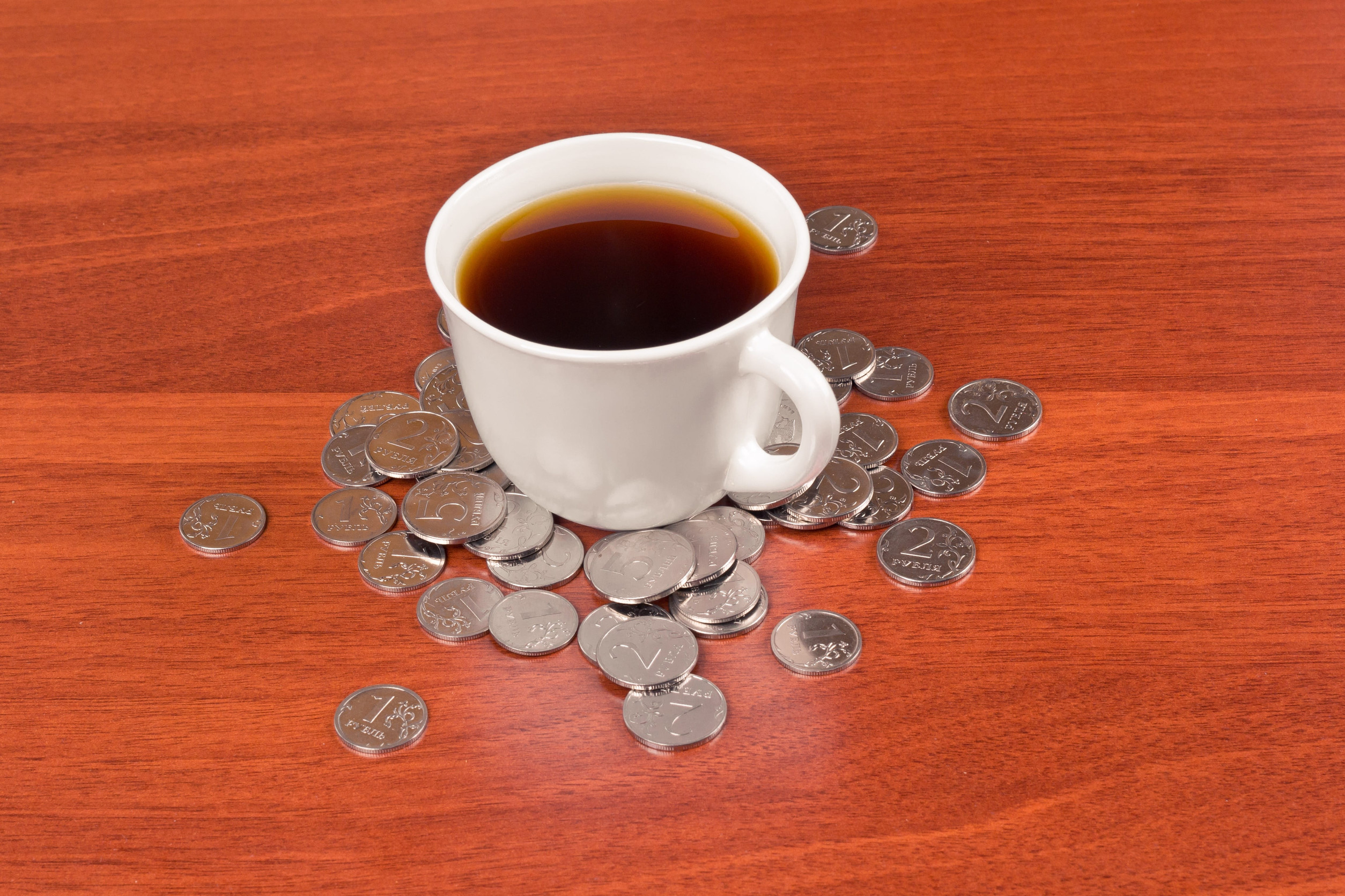 Cup of coffee and napkin on table