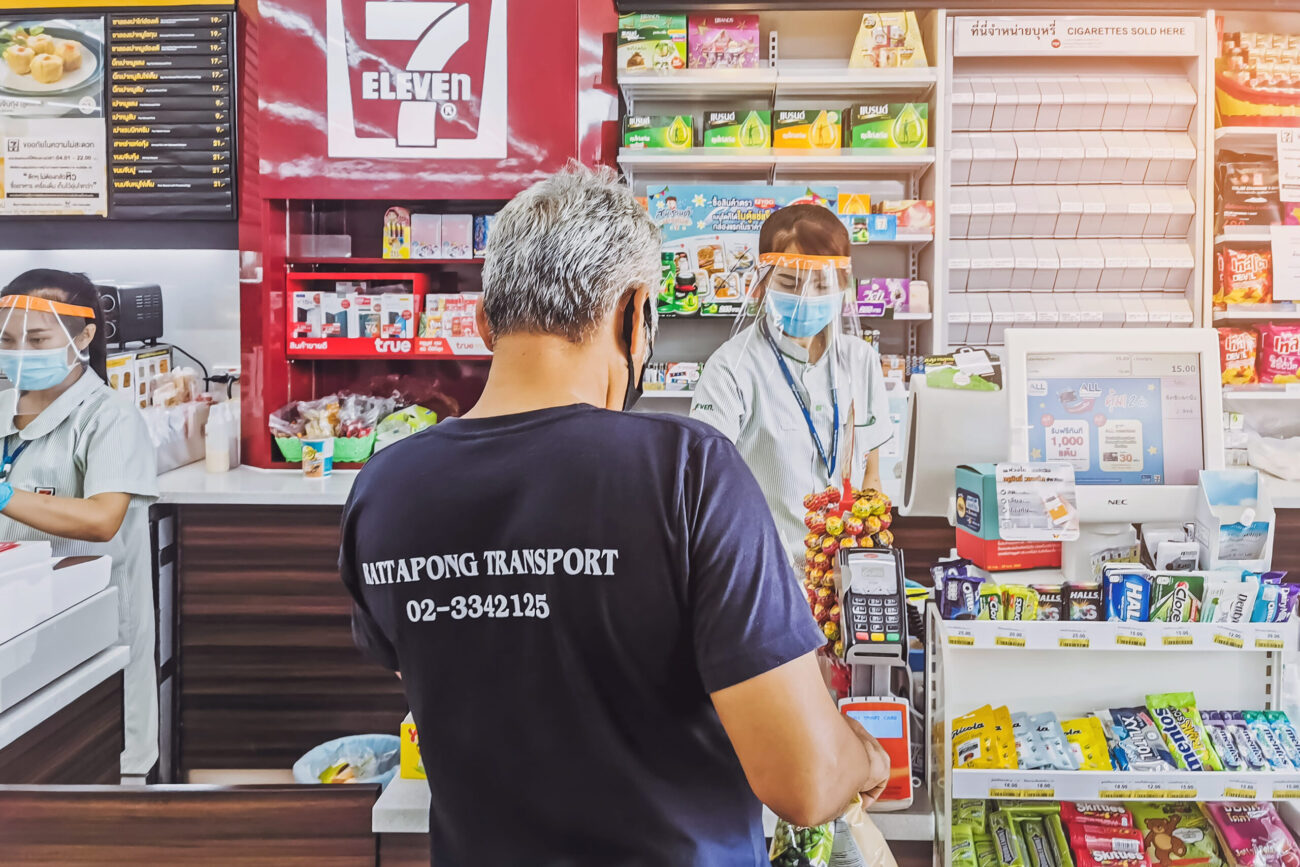 Unidentified Cashier or 7-eleven staff and customers . Image Credit: jinnaritt/ 123RF