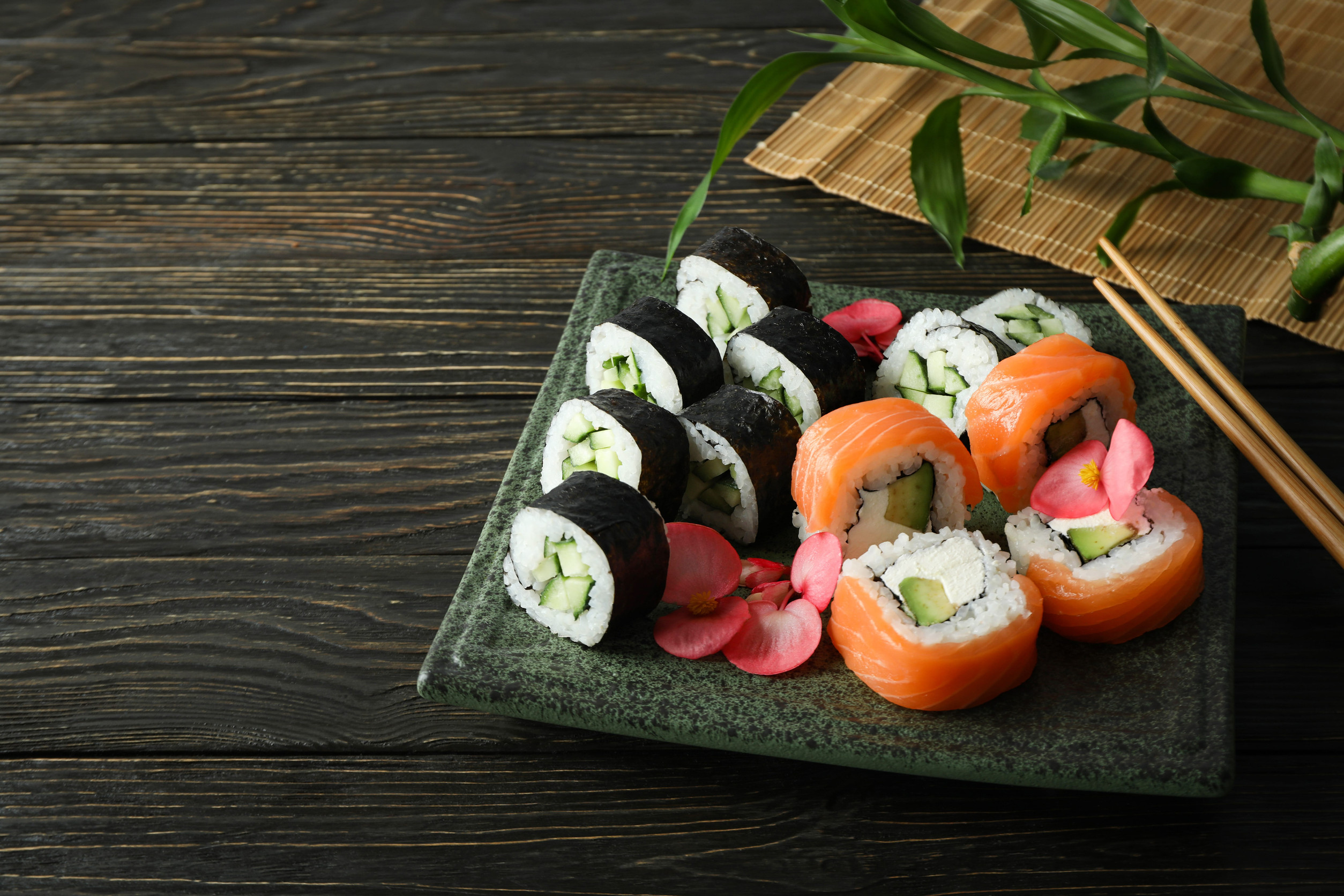 Concept of tasty food with sushi, space for text