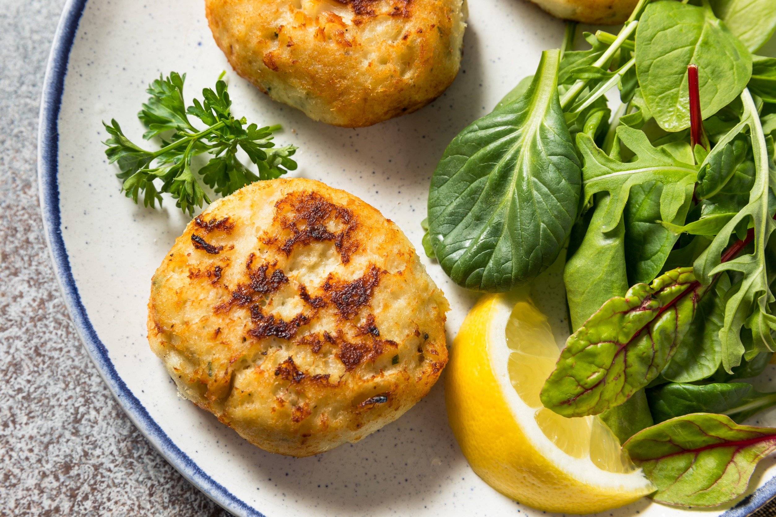 Homemade Fried Crab Cakes with Salad and Tartar Sauce