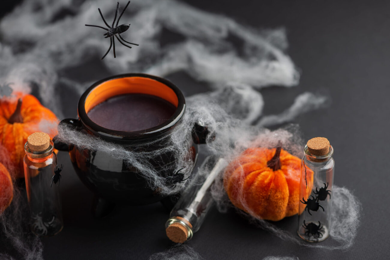 Halloween Cauldron with Pumpkins, Spiders and Cobwebs. Image Credit: tshum/ 123RF