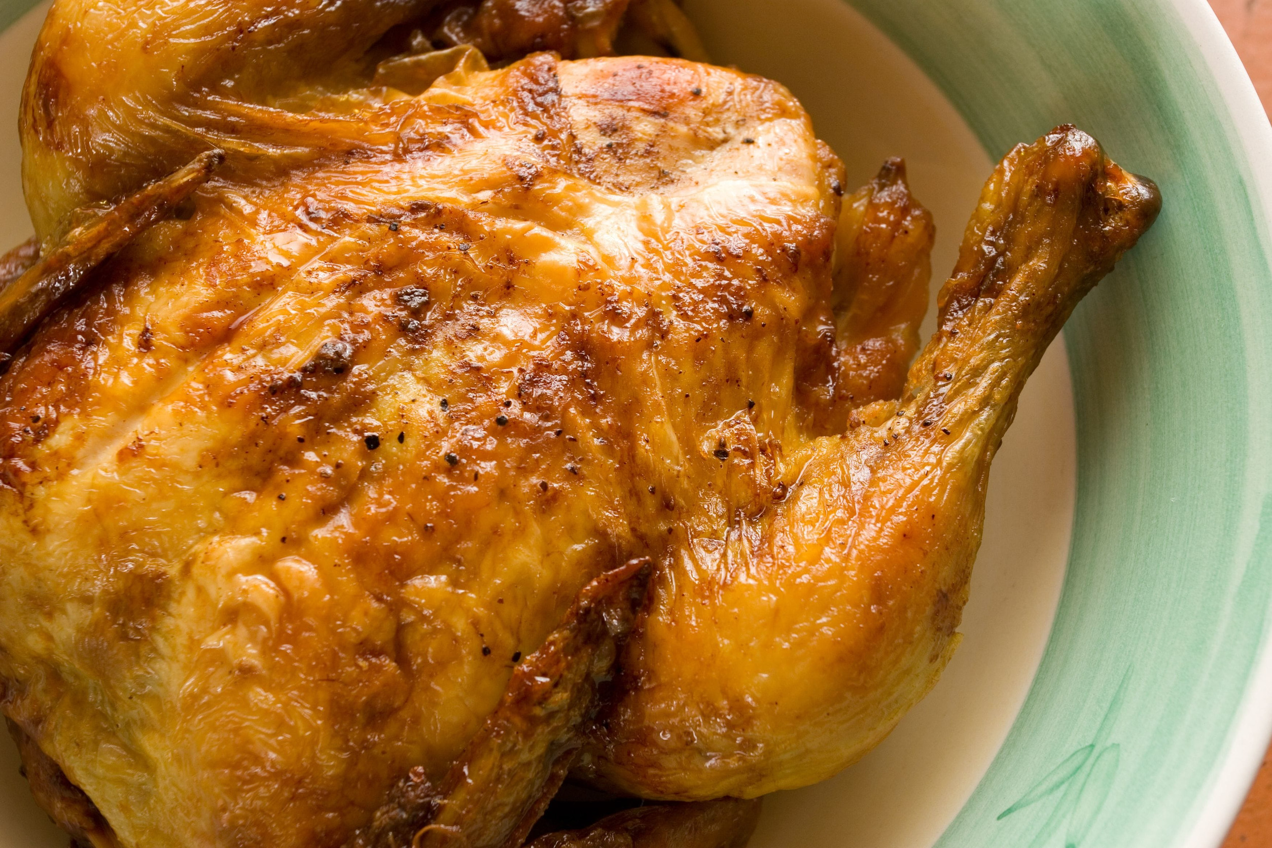 Prepared whole chicken on a plate