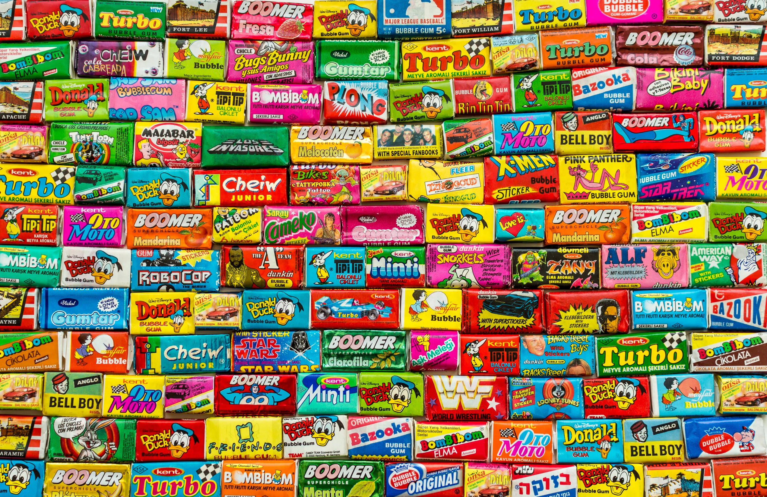 ASHDOD, ISRAEL - SEPTEMBER 27, 2015: Many various colorful chewing or bubble gum from seventies, eighties and nineties, including Robocop, Turbo, Donald Duck, BomBibom, TipiTip, X-Men, Dunkin, OtoMoto