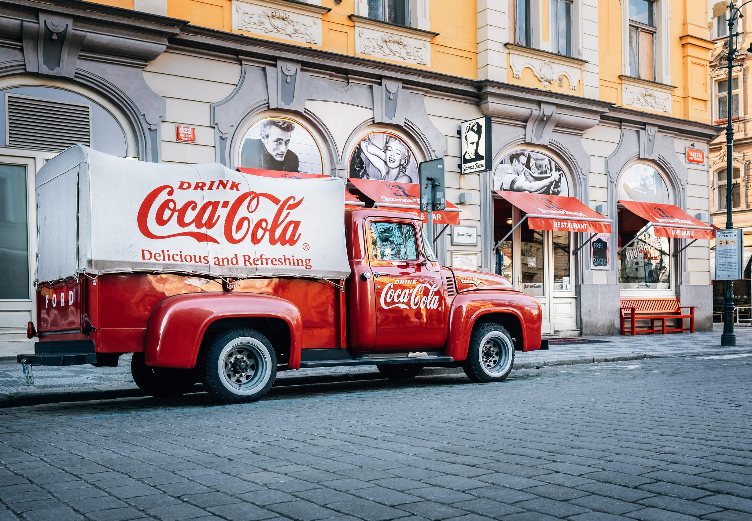 Prague, Czech Republic - May 7, 2017: An old renovated 1930s - 1940s Coca-Cola red pickup truck 1934 Ford parking on Prague street in Prague, Czech Republic