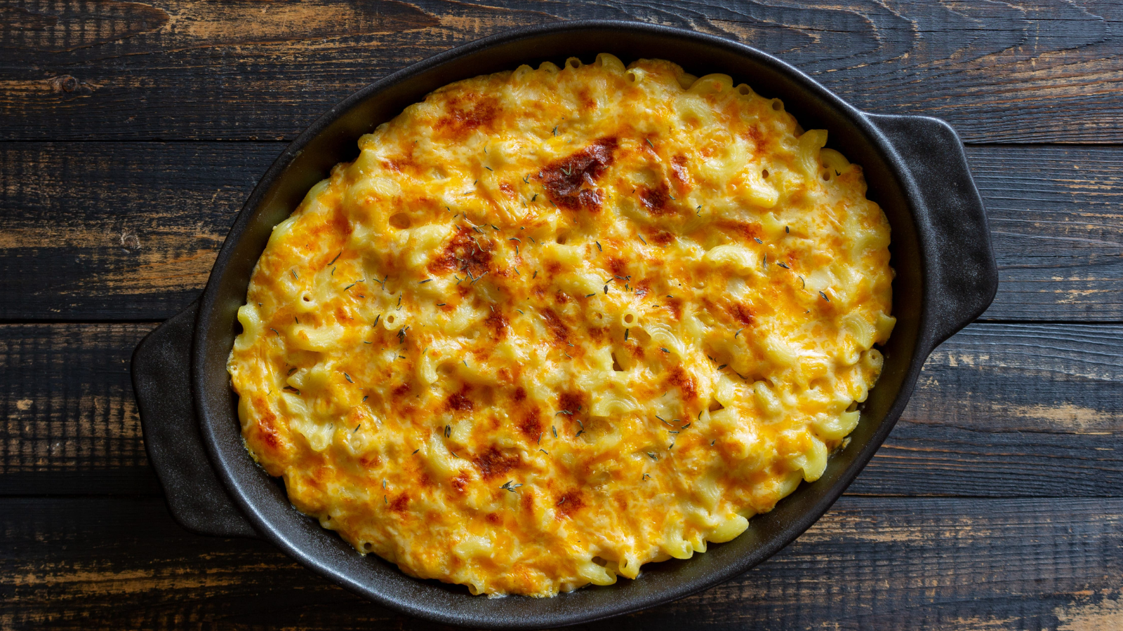 Indulge in a creamy, cheesy baked macaroni dish that promises comfort in every bite. Golden and bubbling, this classic favorite is perfect for gatherings or a cozy night in, showcasing the ultimate in home-cooked goodness. Image Credit: vladislavchusov/ 123RF