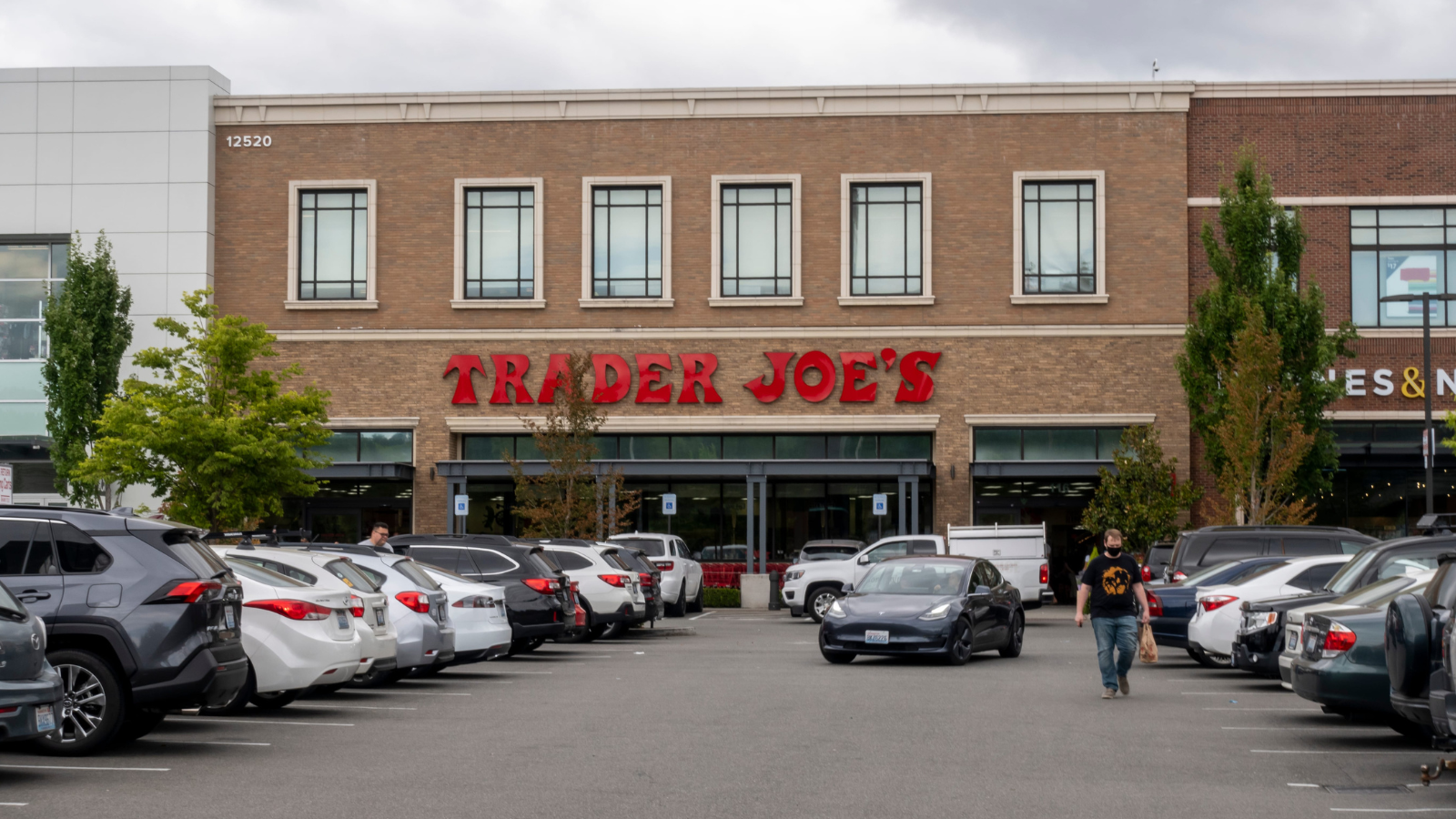 Exterior view of a Trader Joe's grocery store on an overcast day. Image Credit: aca09595/ 123RF