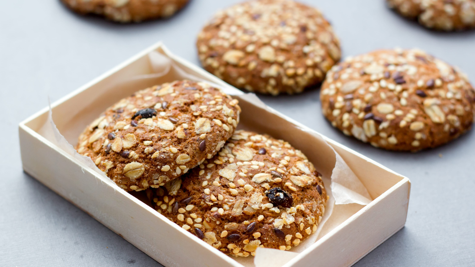Delight in the wholesome goodness of homemade oat cookies, perfectly baked and nestled in a charming wooden box, ready to be savored with a warm cup of tea. Each cookie, adorned with oats and a hint of sweetness, promises a delightful crunch and a nourishing treat for any time of the day. Image Credit: kseniakonakova/ 123RF
