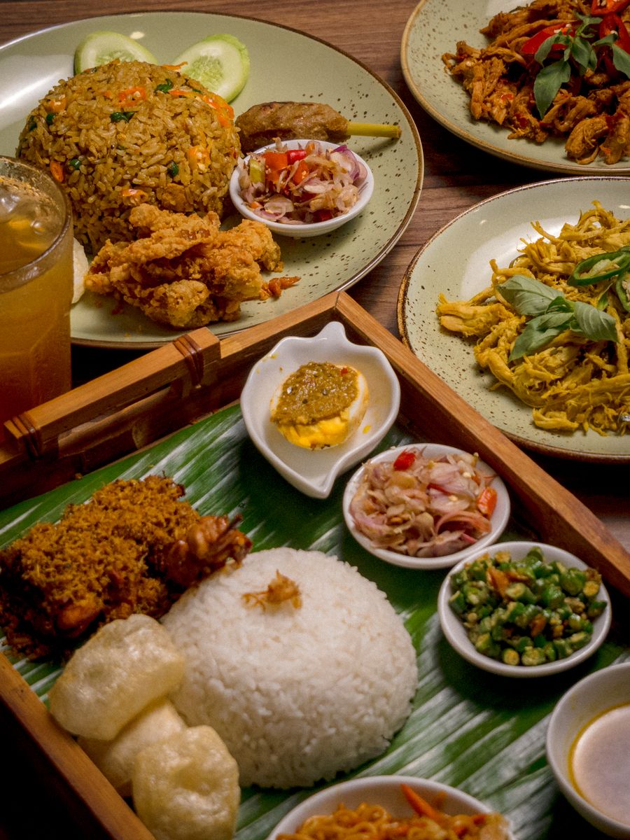 Authentic Indonesian dishes served in Jakarta, showcasing nasi goreng and spicy sambal in a colorful setting.