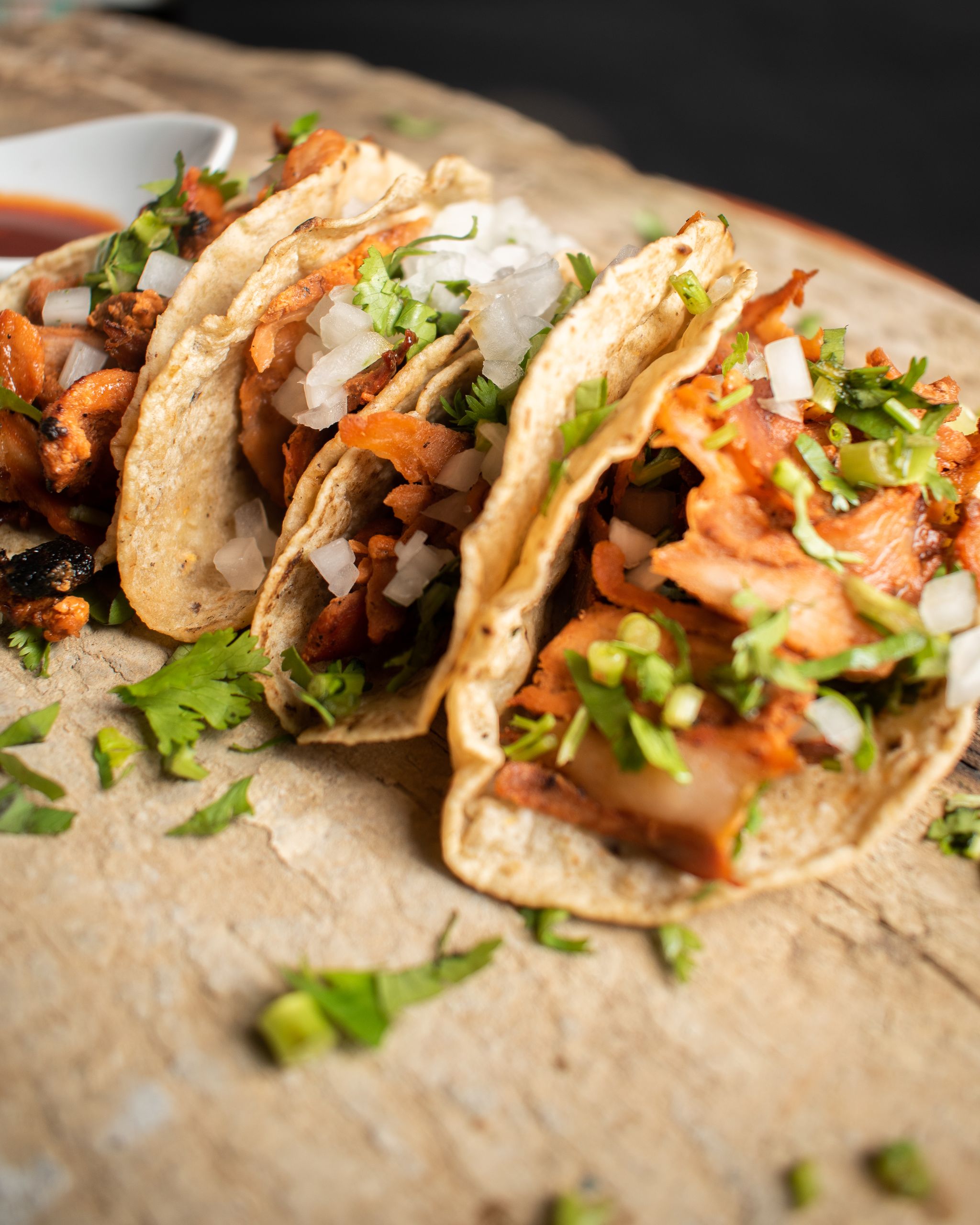 Authentic Mexican tacos with onions and cilantro, perfect for a gourmet culinary experience.