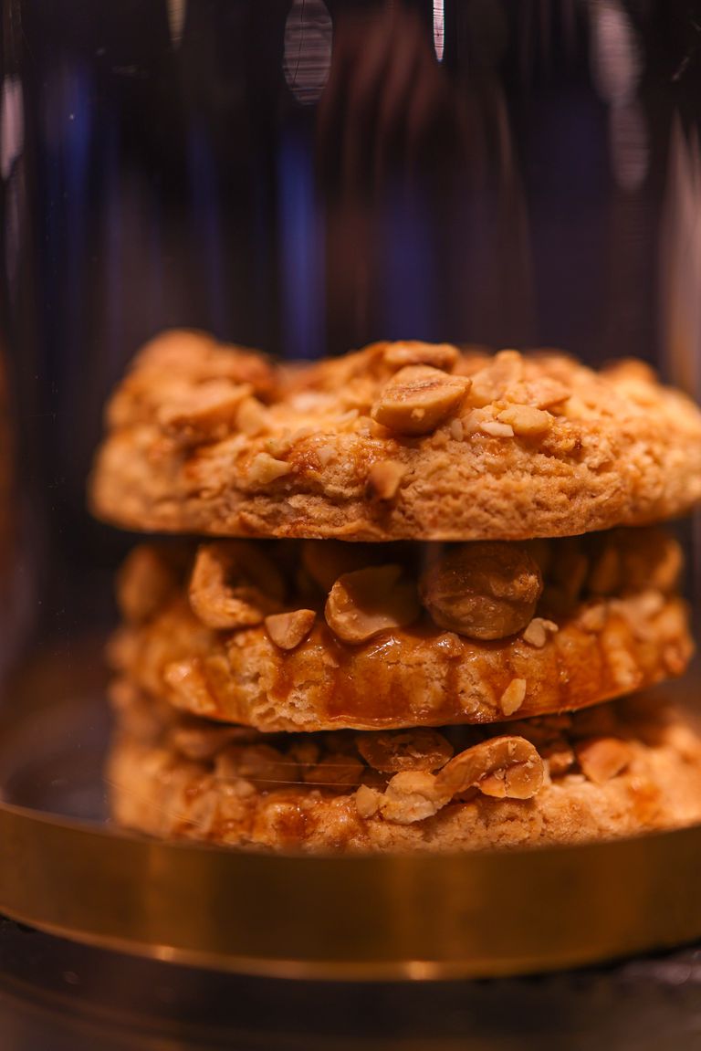 Close-up of stacked peanut cookies with a warm, inviting lighting tone perfect for baking themes.