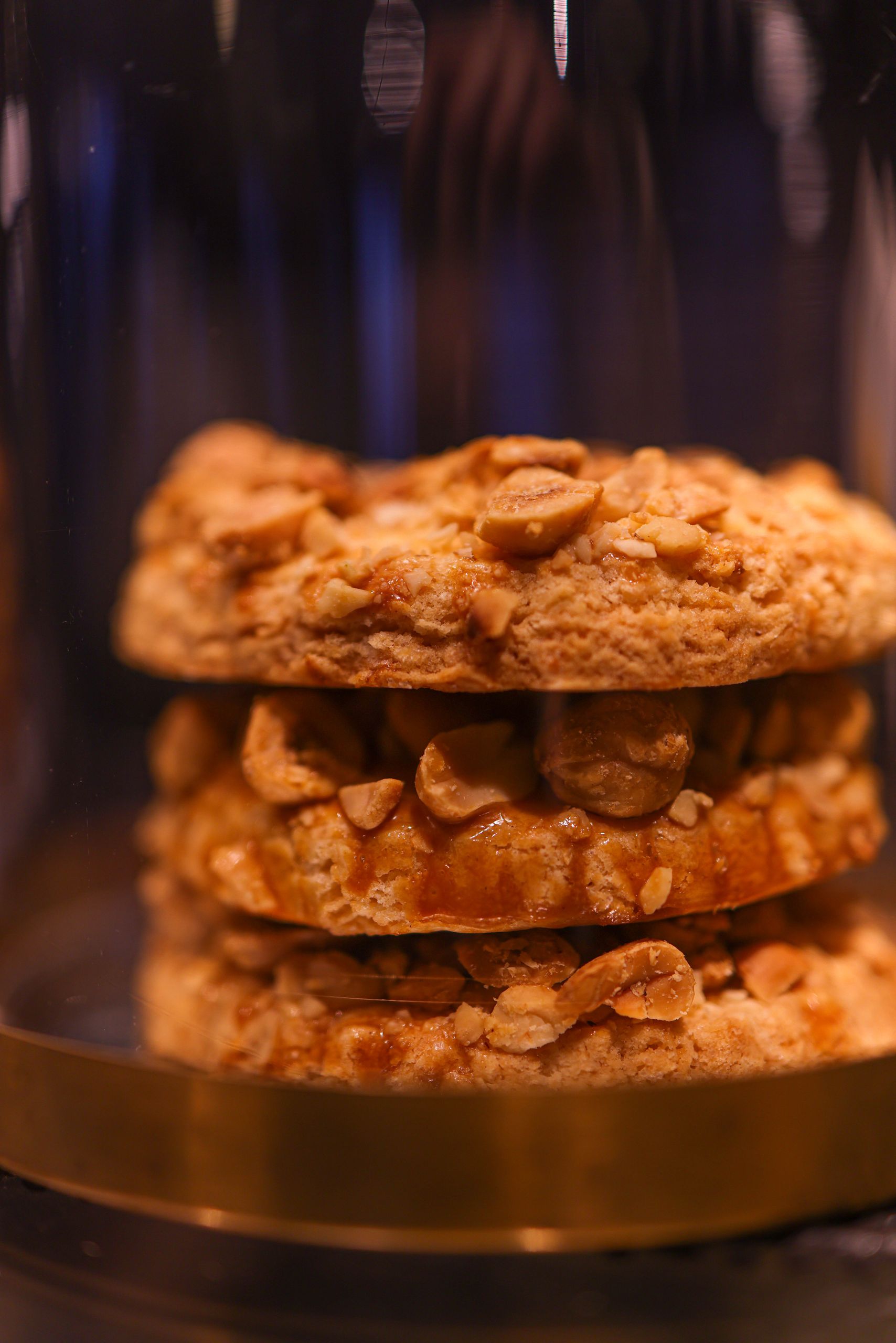 Close-up of stacked peanut cookies with a warm, inviting lighting tone perfect for baking themes.