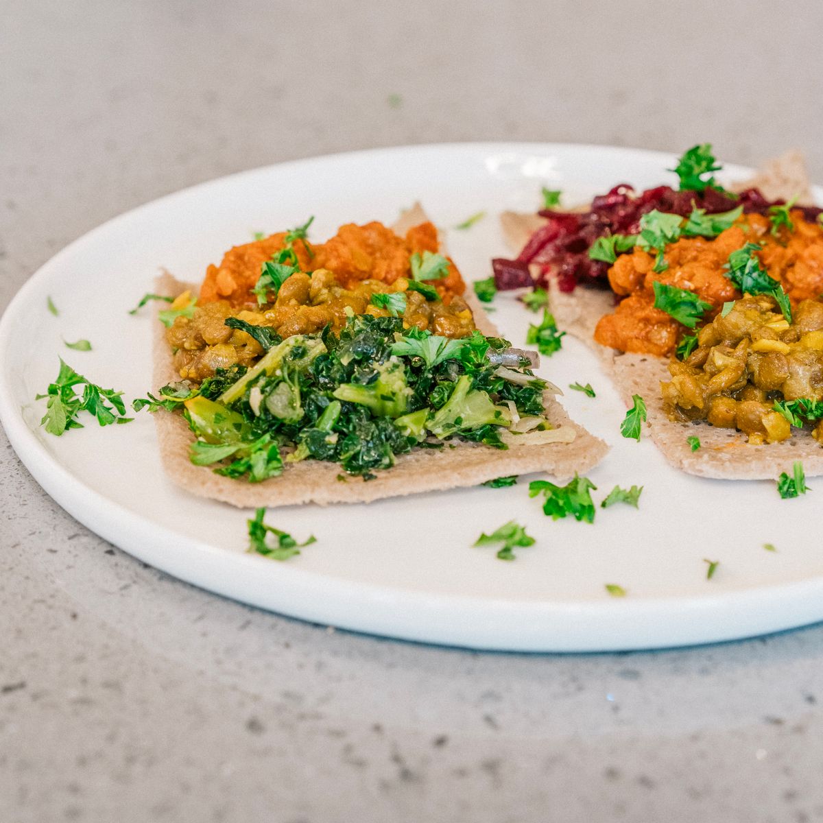 Colorful vegetable appetizers served on a white plate enhance any table setting.