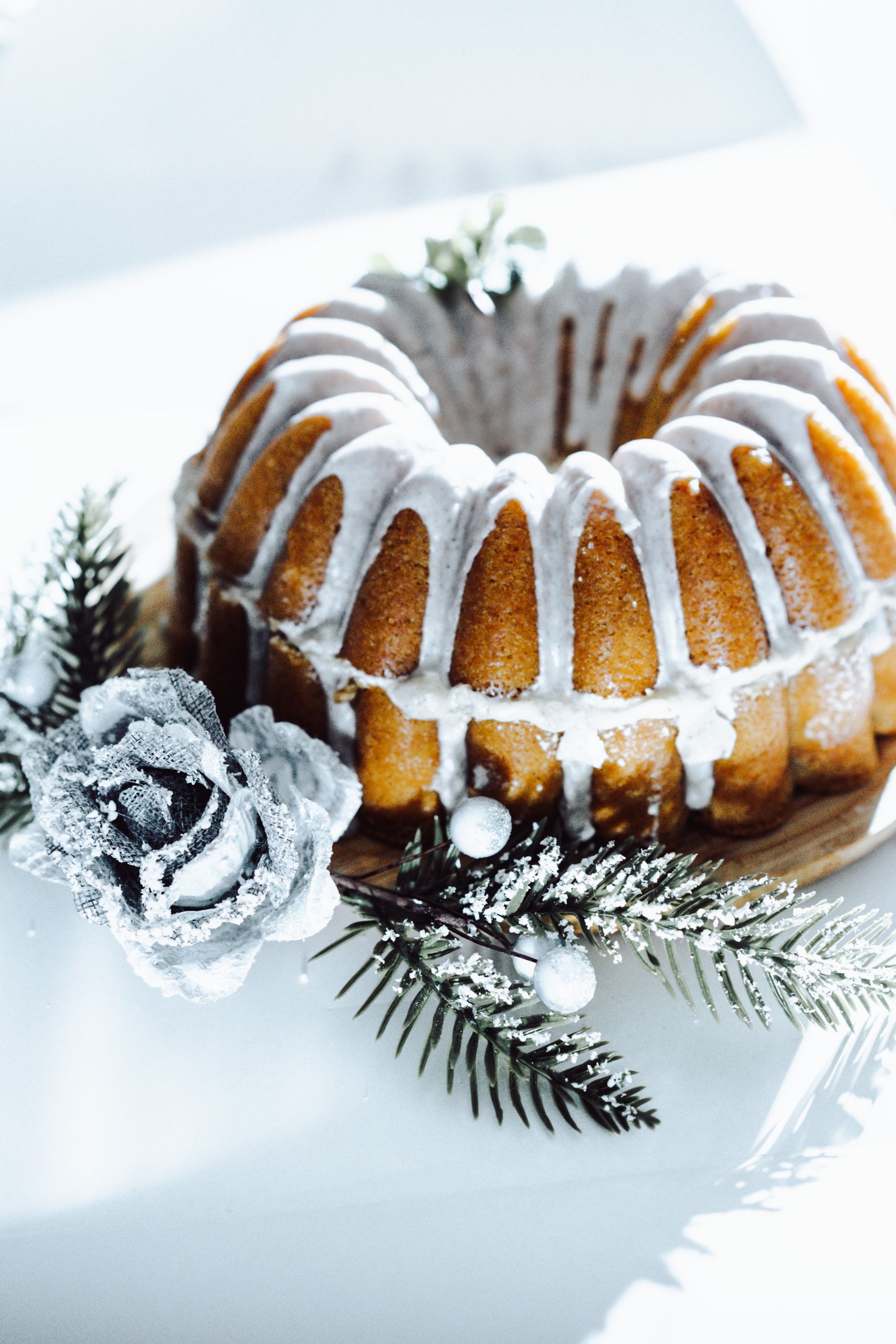Delicious Bundt cake adorned with icing and winter-themed embellishments, perfect for festive occasions.
