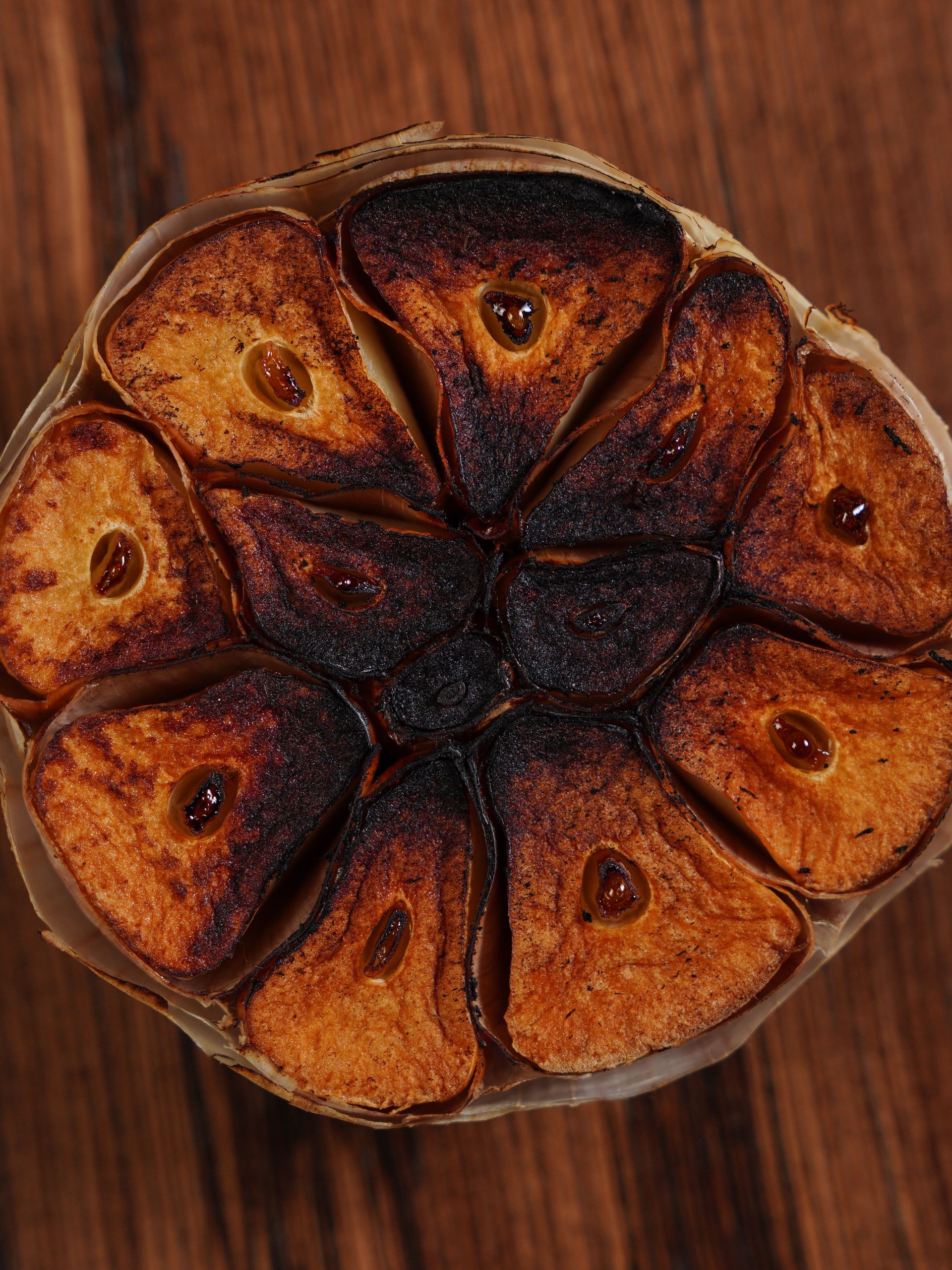 Detailed view of a roasted garlic bulb, perfect for culinary and food-related themes.