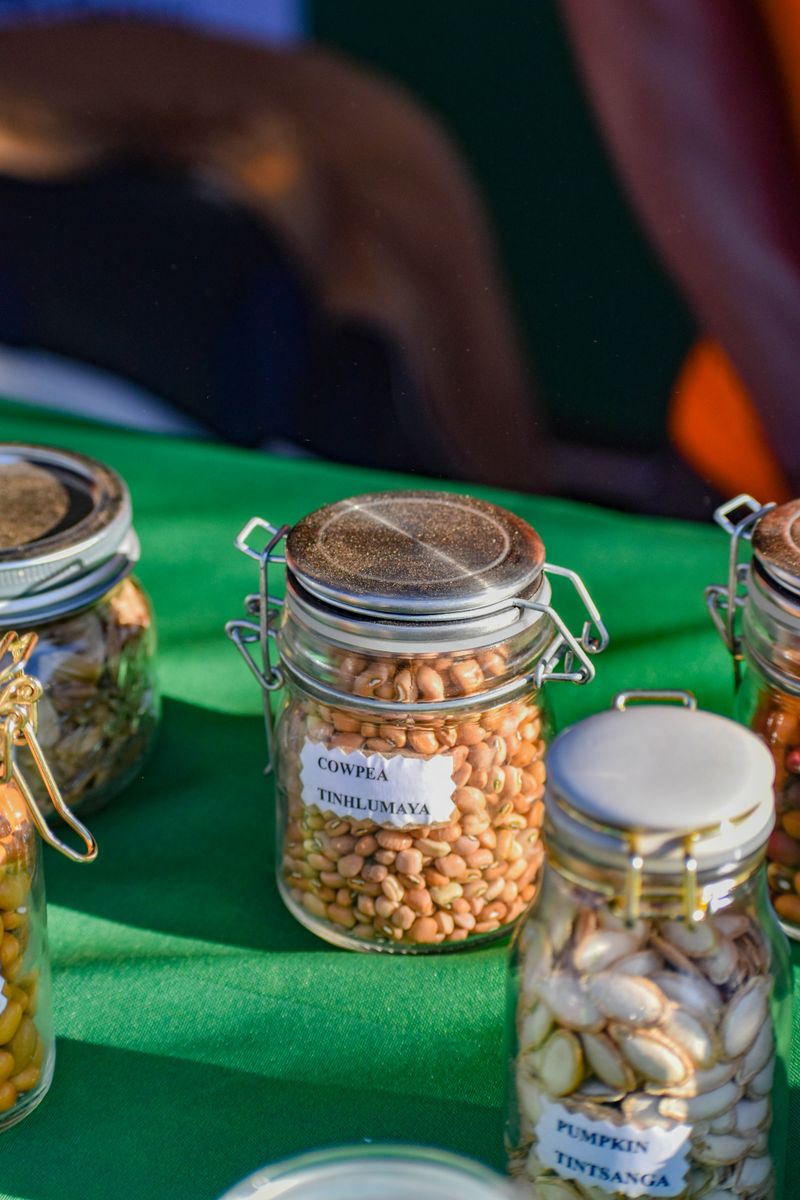 Jars of traditional Eswatini seeds, including Cowpea, on display at a local market.