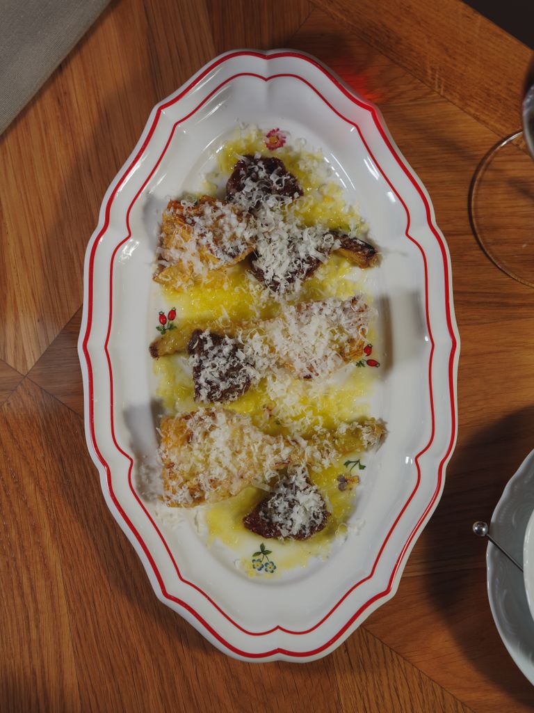 Parmesan mushrooms elegantly plated on a decorative dish for an inviting meal.
