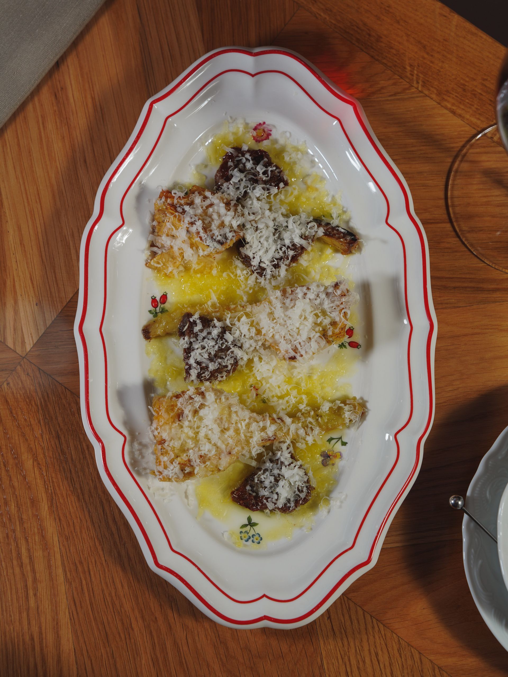 Parmesan mushrooms elegantly plated on a decorative dish for an inviting meal.