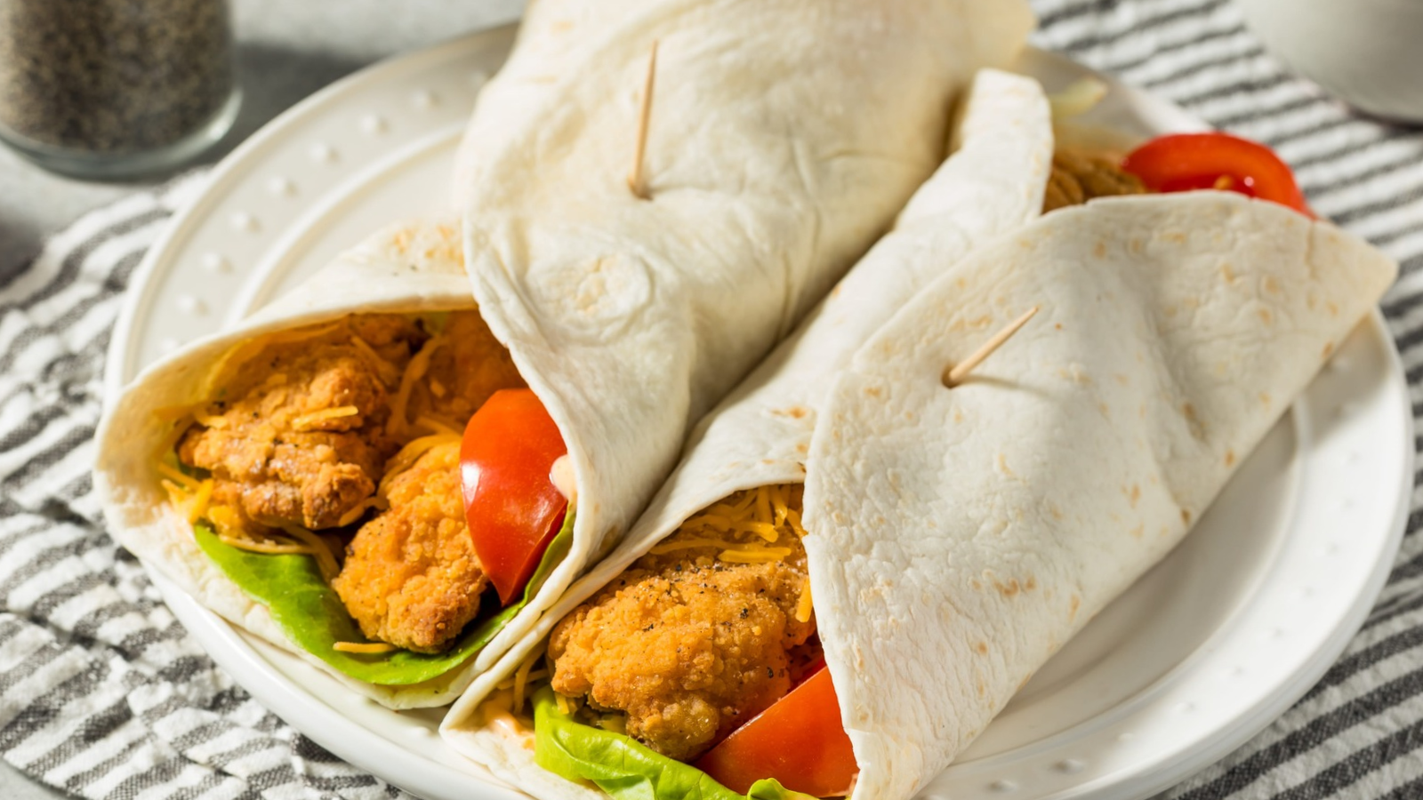 Healthy Fried Chicken Wrap with Tomato and Lettuce. Image Credit: bhofack2/ 123RF